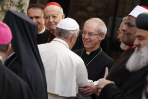 Pope Francis exchanges greetings with Anglican Archbishop Justin Welby of Canterbury, England, spiritual leader of the Anglican Communion, as he arrives for an interfaith peace gathering at the Basilica of St. Francis in Assisi, Italy, Sept. 20. The peace gathering marks the 30th anniversary of the first peace encounter in Assisi in 1986. (CNS photo/Paul Haring) 