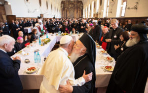 Pope Francis is greeted by Ecumenical Patriarch Bartholomew of Constantinople during an interfaith peace gathering Sept. 20 at the Basilica of St. Francis in Assisi, Italy. The peace gathering marks the 30th anniversary of the first peace encounter in Assisi. (CNS photo/L'Osservatore Romano handout via Reuters) 