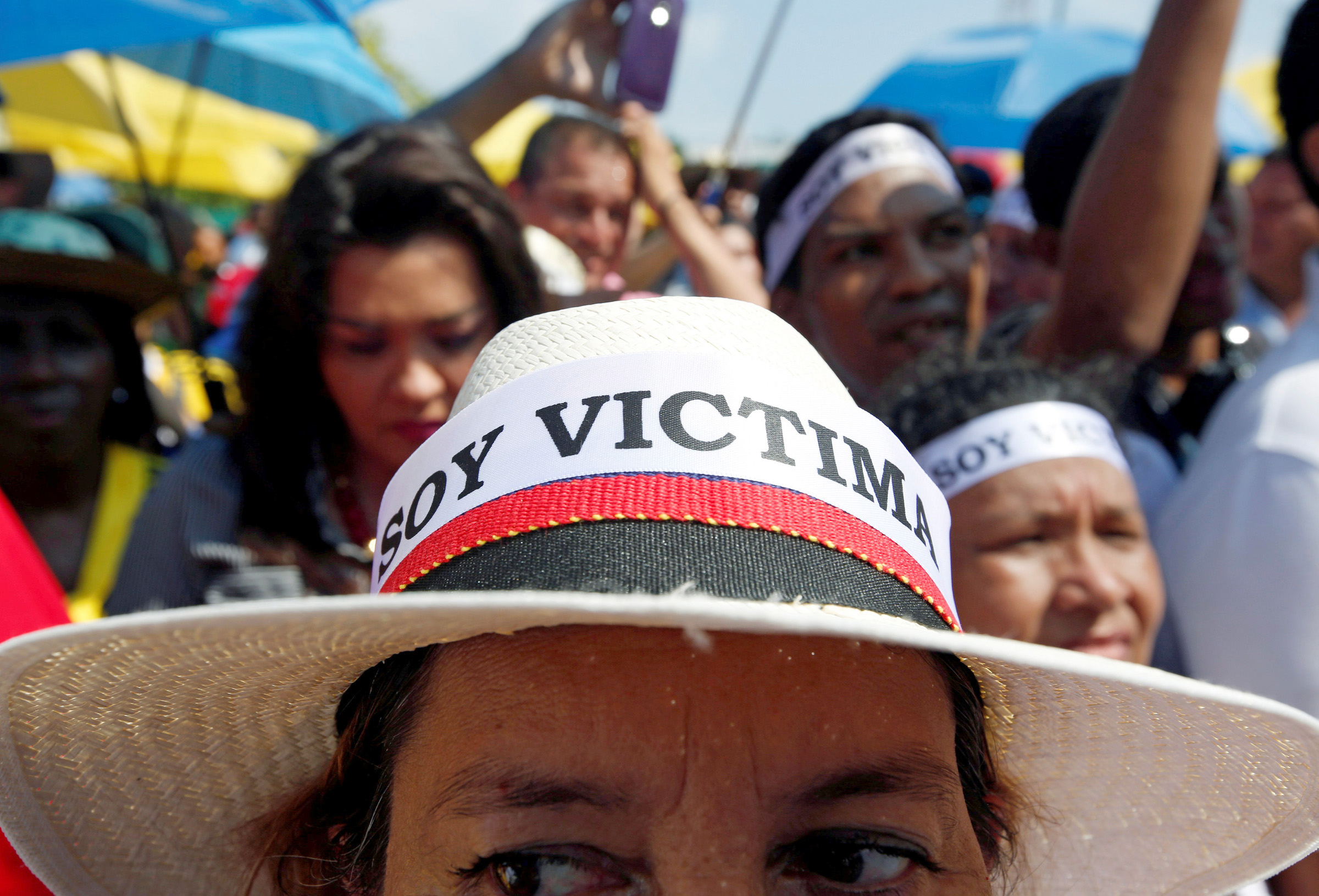 A demonstrator with an "I am a victim" hat protests the government's peace accord with the Revolutionary Armed Forces of Colombia in Cartagena, Colombia, Sept. 26. The peace accord would allow rebels to enter parliament without serving any jail time. (CNS photo/John Vizcaino, Reuters)