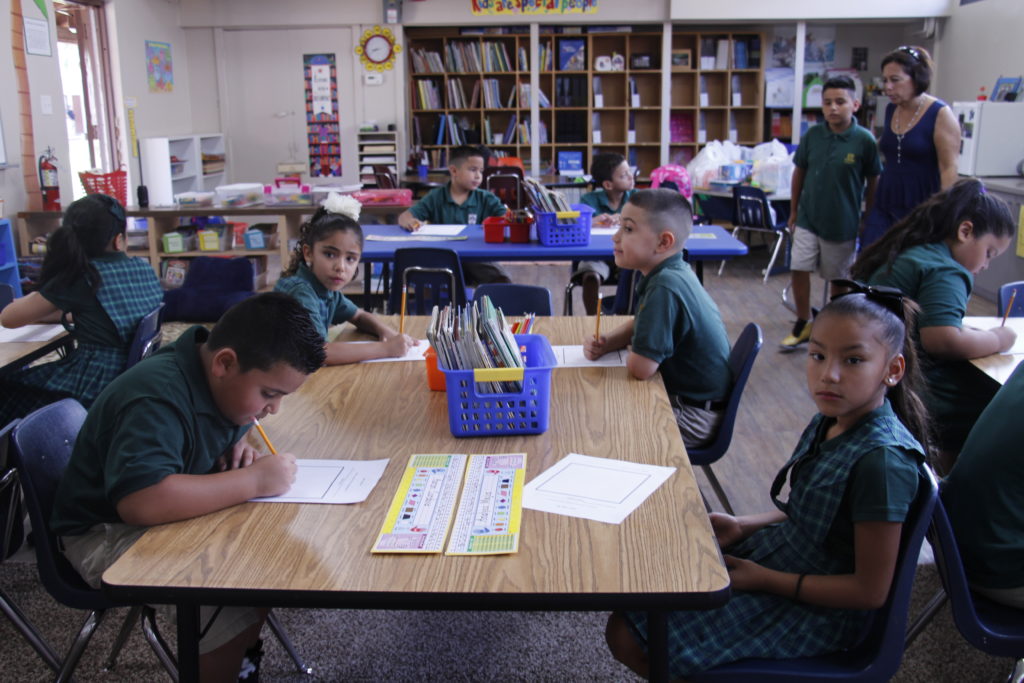 Second-graders at St. Agnes work on short writing projects on the first day of school Aug. 10.  (Ambria Hammel/CATHOLIC SUN)
