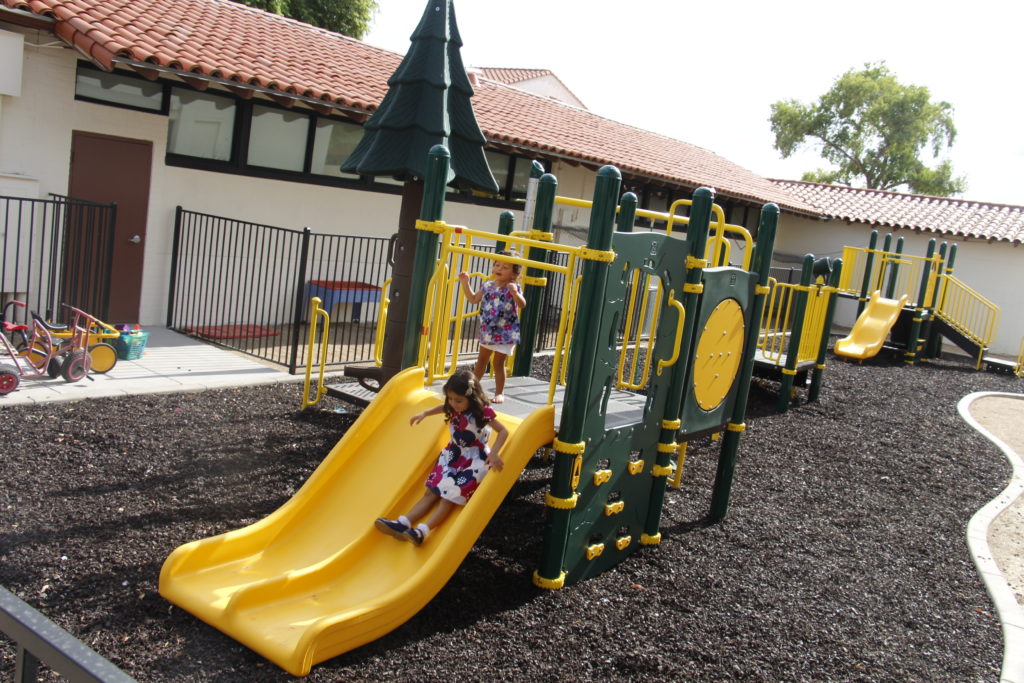 Children test out new playground equipment at St. Agnes Aug. 10. Shea Homes provided the school with essentially its first major renovation since it opened more than 70 years ago.i (Ambria Hammel/CATHOLIC SUN)
