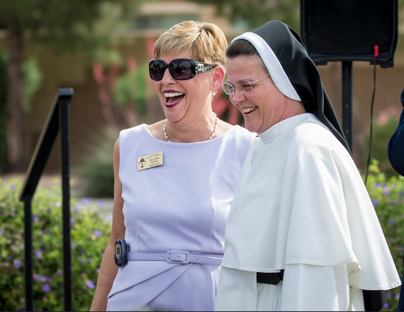MaryBeth Mueller, superintendent for the Diocese of Phoenix, stands with Sr. Mary Jordan Hoover, OP, April 5 during a site blessing at the forthcoming St. John Paul II Catholic High School in Avondale. (Billy Hardiman) 