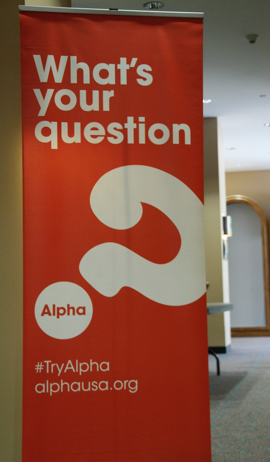 An Alpha banner sits outside of the registration area for a "Getting Started with Alpha" workshop Aug. 26 at the Diocesan Pastoral Center. (Ambria Hammel/CATHOLIC SUN)