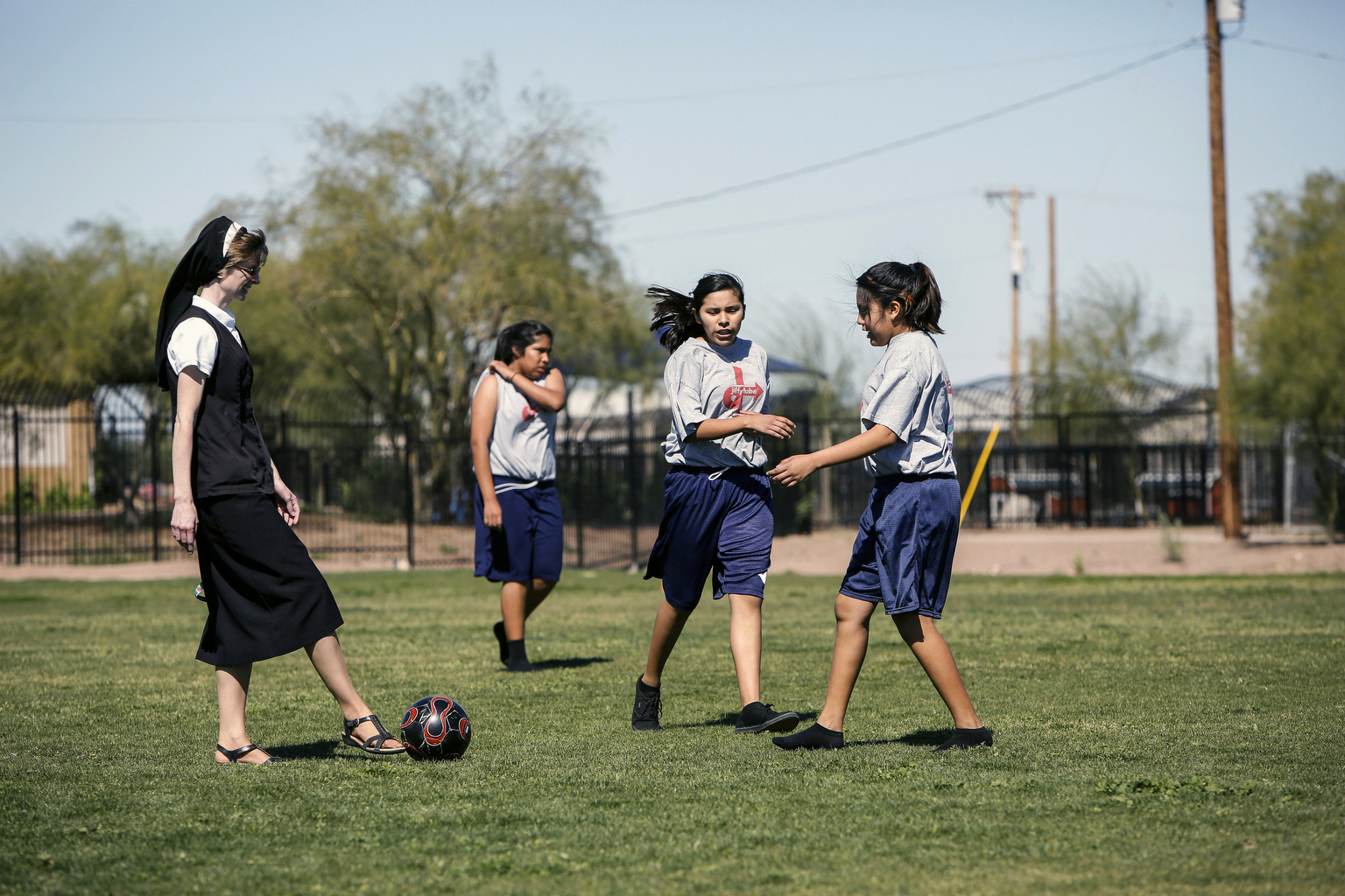 Sr. Pamela Catherine Peasel takes to the soccer field with her junior high school girls at St. Peter Indian Mission School in Bapchule, Ariz. Franciscan Sisters of Christian Charity have served the Gila River Indian Community since 1935. (CNS photo/Nancy Wiechec)