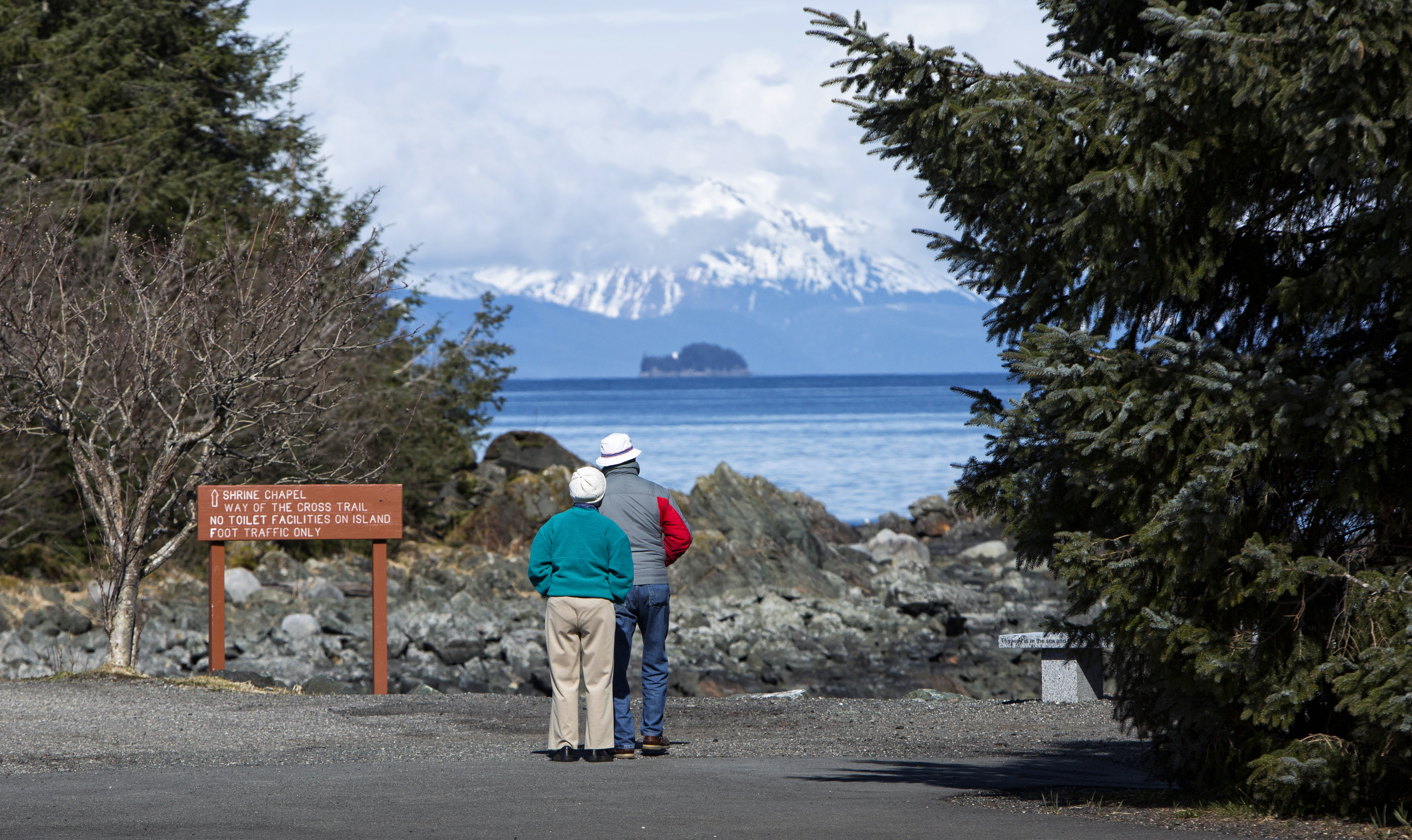 Visitors look out over the water in 2014 at the Shrine of St. Thérèse in Juneau, Alaska. The place of retreat with breathtaking views was designated a national shrine by the U.S. bishops Oct. 1. (CNS photo/Nancy Wiechec)