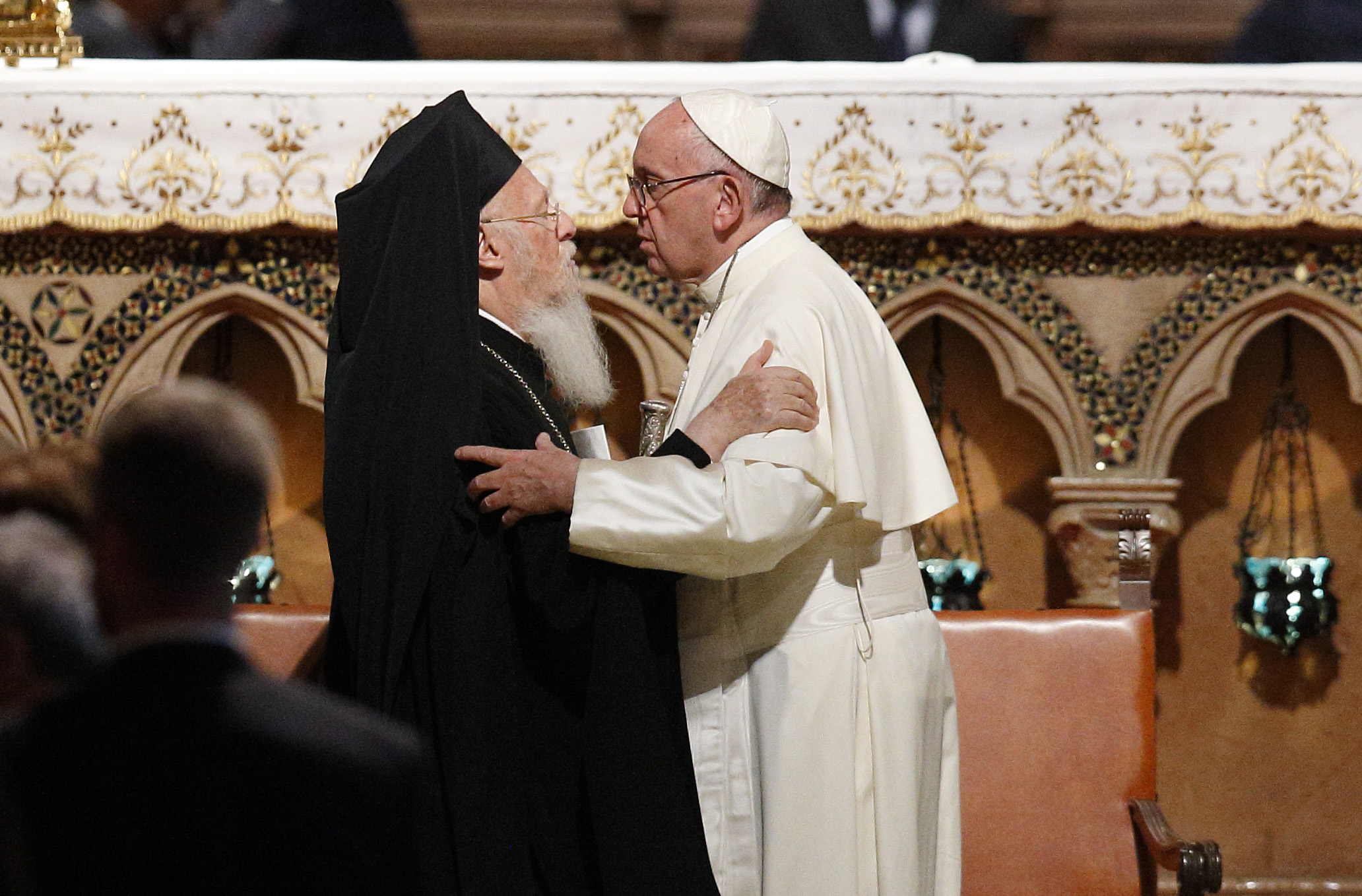 Pope Francis embraces Ecumenical Patriarch Bartholomew of Constantinople during an ecumenical prayer service with religious leaders in the Basilica of St. Francis in Assisi, Italy, Sept. 20. (CNS photo/Paul Haring)