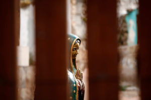 A statue of Our Lady of Guadalupe is seen through the international border fence in Nogales, Ariz., Oct. 23 during a special Mass organized by Dioceses Without Borders. (CNS photo/Nancy Wiechec) 