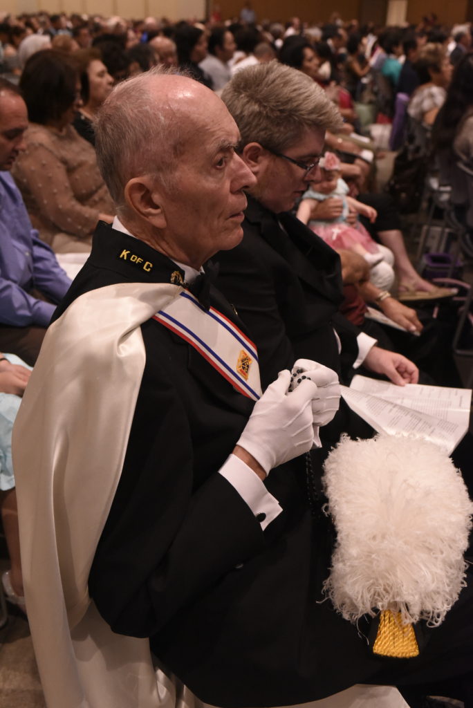 A member of the Fourth Degree Knights of Columbus honor guard prays the Rosary during the Arizona Rosary Celebration Oct. 23. The Knights' Arizona State Council co-sponsors the annual event. (Photo courtesy of Catholic Media Ministry)