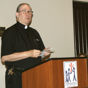 Jesuit Father Dan Sullivan, pastor of St. Francis Xavier Parish, leads the opening prayer for the ACSDF panel Oct. 2. (Photo courtesy of Lisa Fischer/ACSDF)