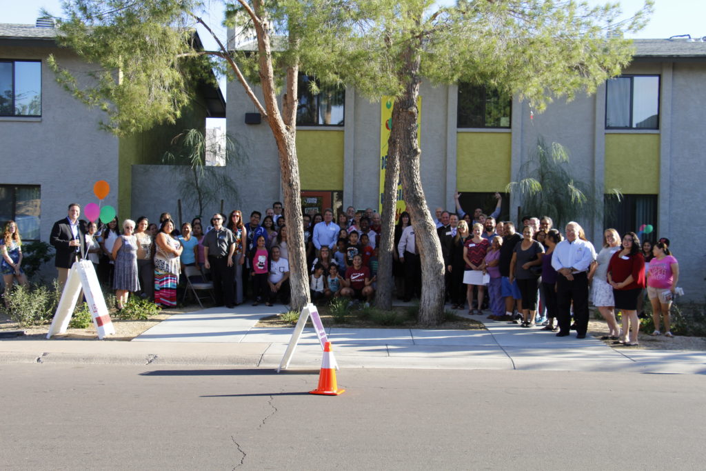 Residents and guests at Desert Willow pose for a group photo at the grand re-opening.
