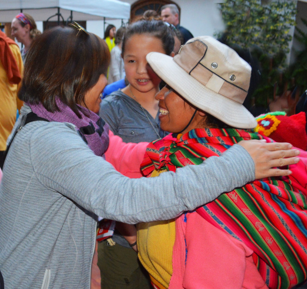 After a day of volunteer work with locals from hill tribes outside Cusco, Peru, Shelly Chang hugs local woman goodbye as daughter Regan (SSJ ‘17) looks on. (courtesy photo)