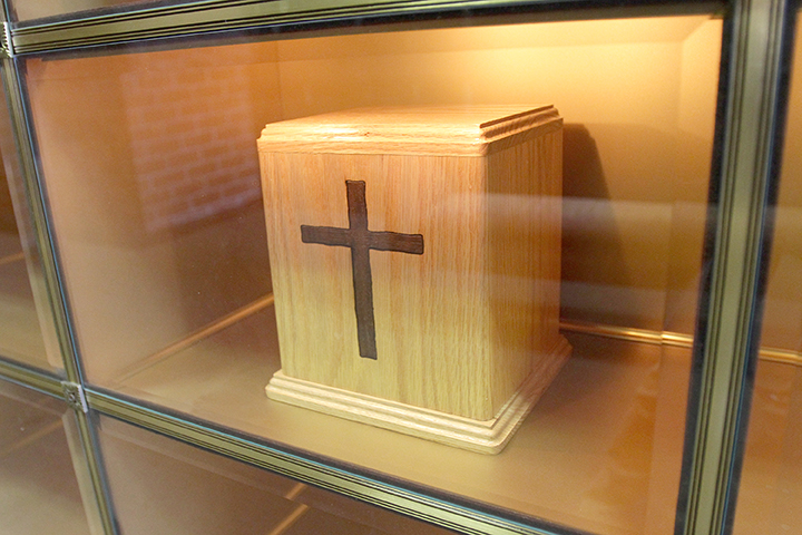 An urn containing cremated remains is seen in a niche in the Holy Rood Cemetery mausoleum in Westbury, N.Y., in 2010. During an Oct. 25 news conference in Rome, Cardinal Gerhard Müller, prefect of the Congregation for the Doctrine of the Faith, said that while the Catholic Church continues to prefer burial in the ground, it accepts cremation as an option, but forbids the scattering of ashes or keeping cremated remains at home. (CNS photo/Gregory A. Shemitz)