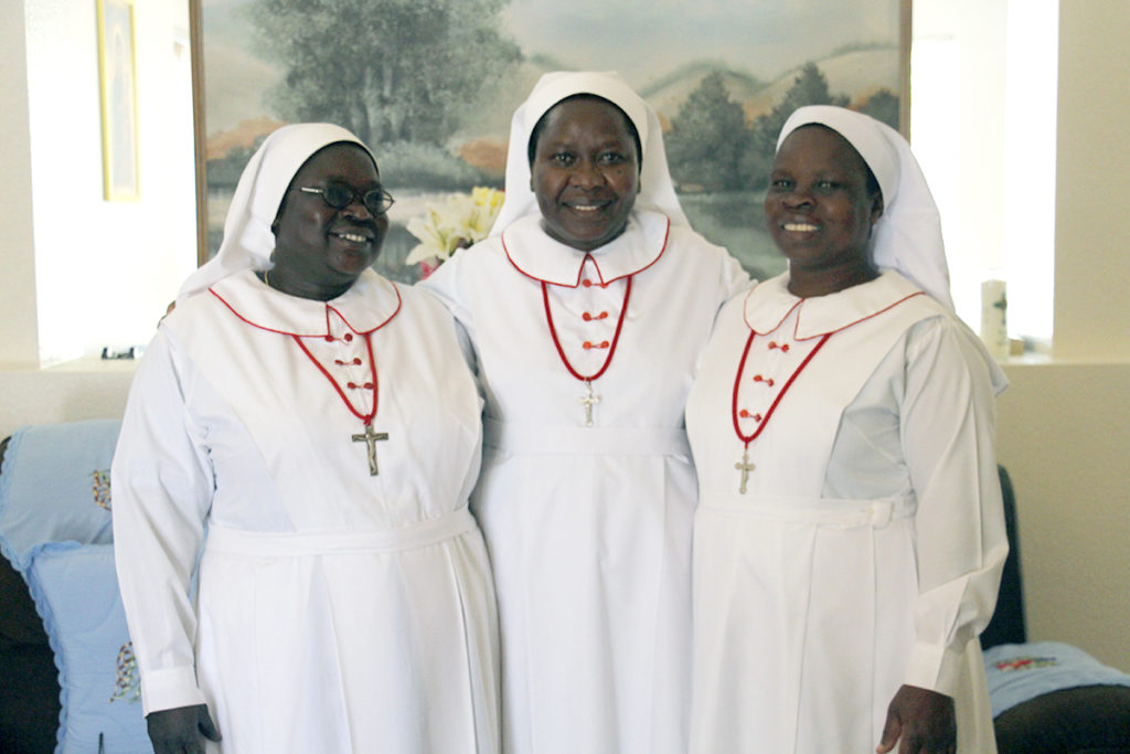 Sisters of the Sacred Heart of Jesus pose for a photo in their Glendale home. They are: Sr. Sophie Angela Lado, Sr. Betty Benjamin Banja and Sr. Betty Duduka.  (Ambria Hammel/CATHOLIC SUN)