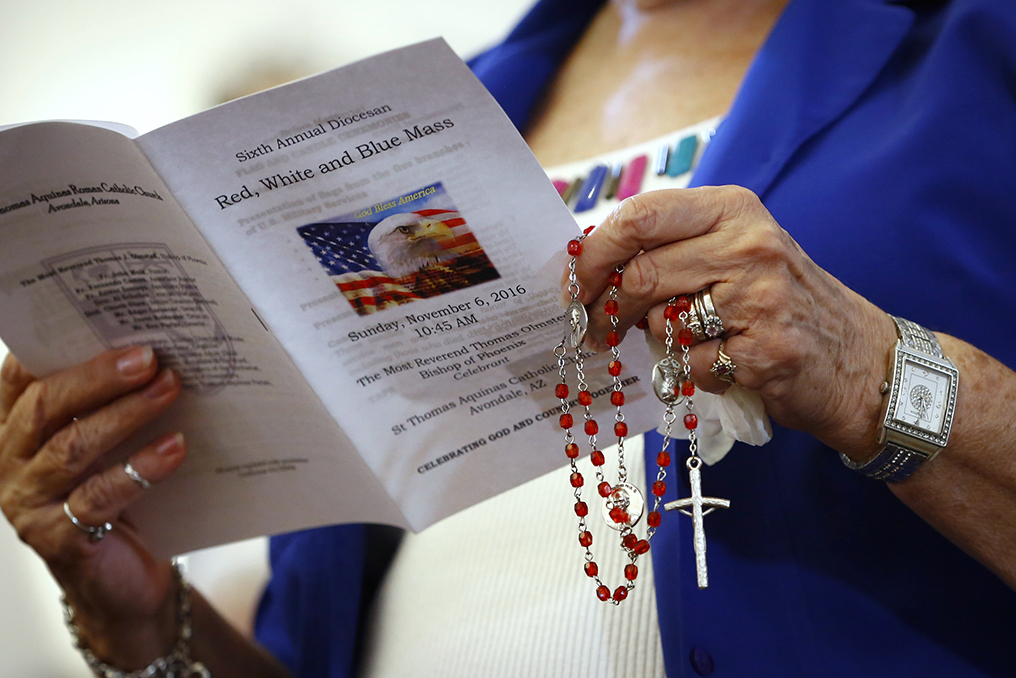 The Diocese of Phoenix marks its sixth annual Red, White and Blue Mass at St. Thomas Aquinas Church in Avondale, Ariz., Nov. 6. The occasion honored active and retired service men and women and recalled those who died in service to the country. Veterans Day is Nov. 11. (CNS photo/Nancy Wiechec)