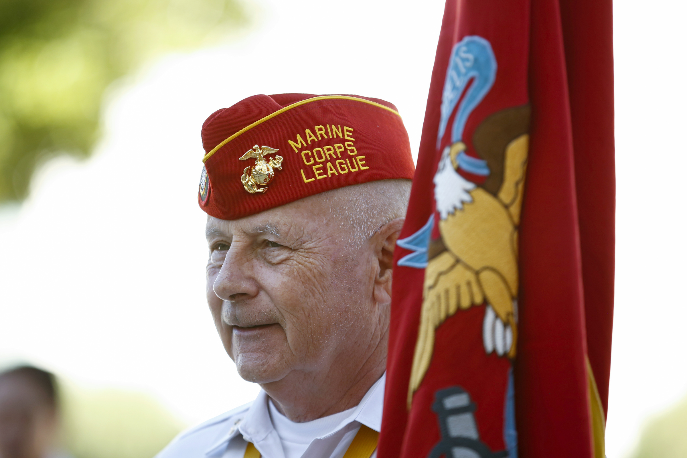 Veteran Gerry Schaller holds the Marine Corps flag following the sixth annual Red, White and Blue Mass at St. Thomas Aquinas Church in Avondale, Ariz., Nov. 6. The Diocese of Phoenix marked the occasion to honor active and retired service men and women and to recall those who died in service to the country. Veterans Day is Nov. 11. (CNS photo/Nancy Wiechec)