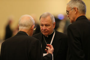 New Orleans Archbishop Gregory M. Aymond, center, speaks with other prelates Nov. 14 during the annual fall general assembly of the U.S. Conference of Catholic Bishops in Baltimore. (CNS photo/Bob Roller) 