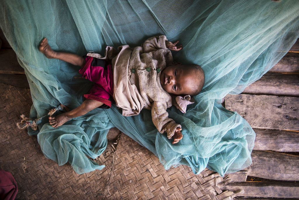 An eight-month-old baby lies on the floor at home in Amboasary, Madagascar, Sept. 21, 2015. Hunger levels are now so severe in drought-ridden southern Madagascar that many people in remote villages have eaten almost nothing but cactus fruit for up to four years, said a Catholic Relief Services official. (CNS photo/Shiraaz Mohamed, EPA) 