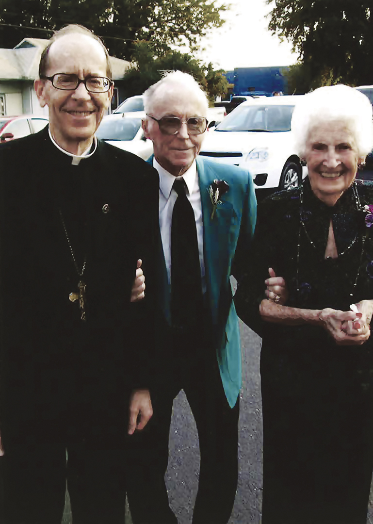 Bishop Thomas J. Olmsted walks with his parents, Patrick and Helen. (Photo courtesy of Bishop Thomas J. Olmsted)