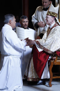 Marvin Silva promises obedience to Bishop Thomas J. Olmsted and his successors during the ordination rite. (Ambria Hammel/CATHOLIC SUN)