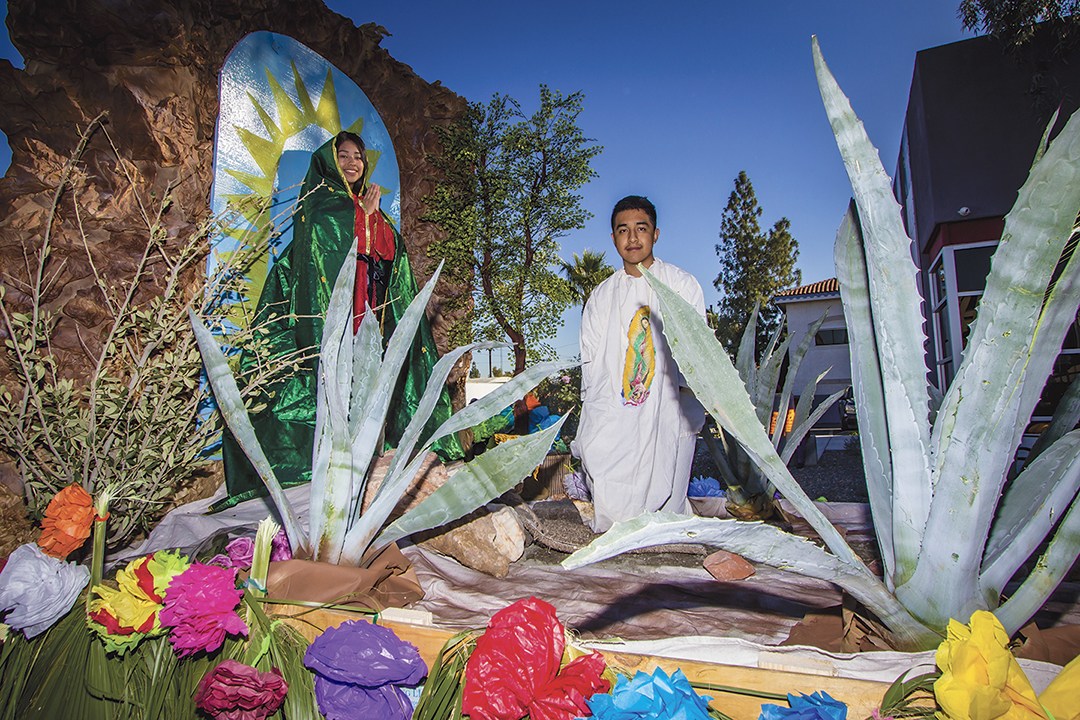 Karen Lopez and Juan Navarro on their float during the Honor Your Mother celebration parade and mass in Downtown Phoenix on Saturday, December 5, 2015. (File photo)