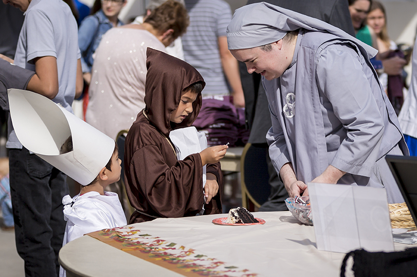 Sr. Mary Claire Strasser, SOLT greets the “Apostles to the Slavs,” the saintly brothers Cyril (right) and Methodius (left). (Billy Hardiman/CATHOLIC SUN)