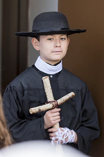 St. Damien, the leper of Molakai, Hawaii, walking out of the church following the Vocations Celebration Mass. (Billy Hardiman/CATHOLIC SUN)