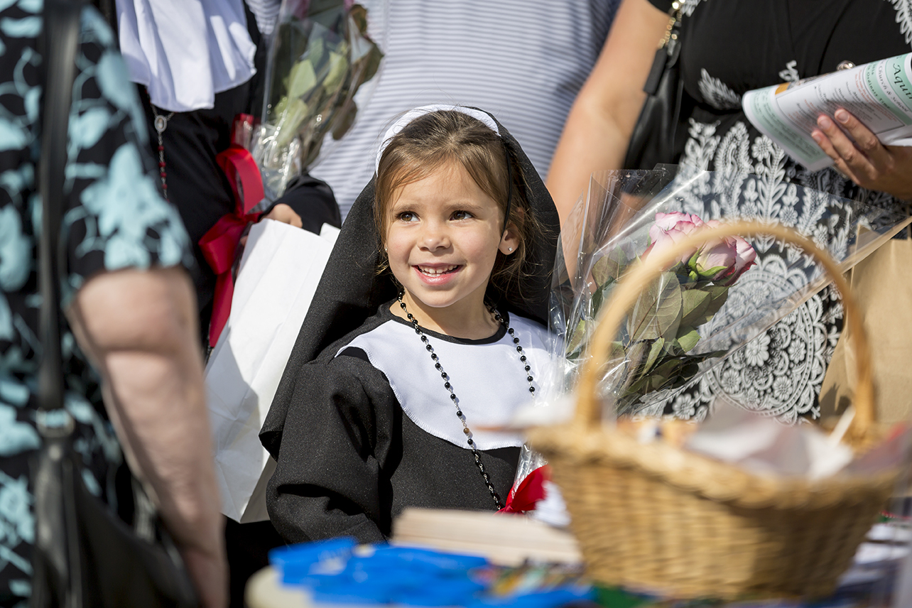 A young girl dressed as St. Thérèse of Lisieux attends the Vocations Celebration at St. Thomas Aquinas Parish in Avondale Oct. 30. (Billy Hardiman/CATHOLIC SUN)