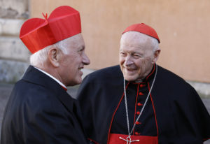 New Cardinal Ricardo Ezzati Andrello of Santiago, Chile, talks with Cardinal Theodore E. McCarrick, retired archbishop of Washington, during a reception for new cardinals at the Vatican in 2014. (CNS photo/Paul Haring) 