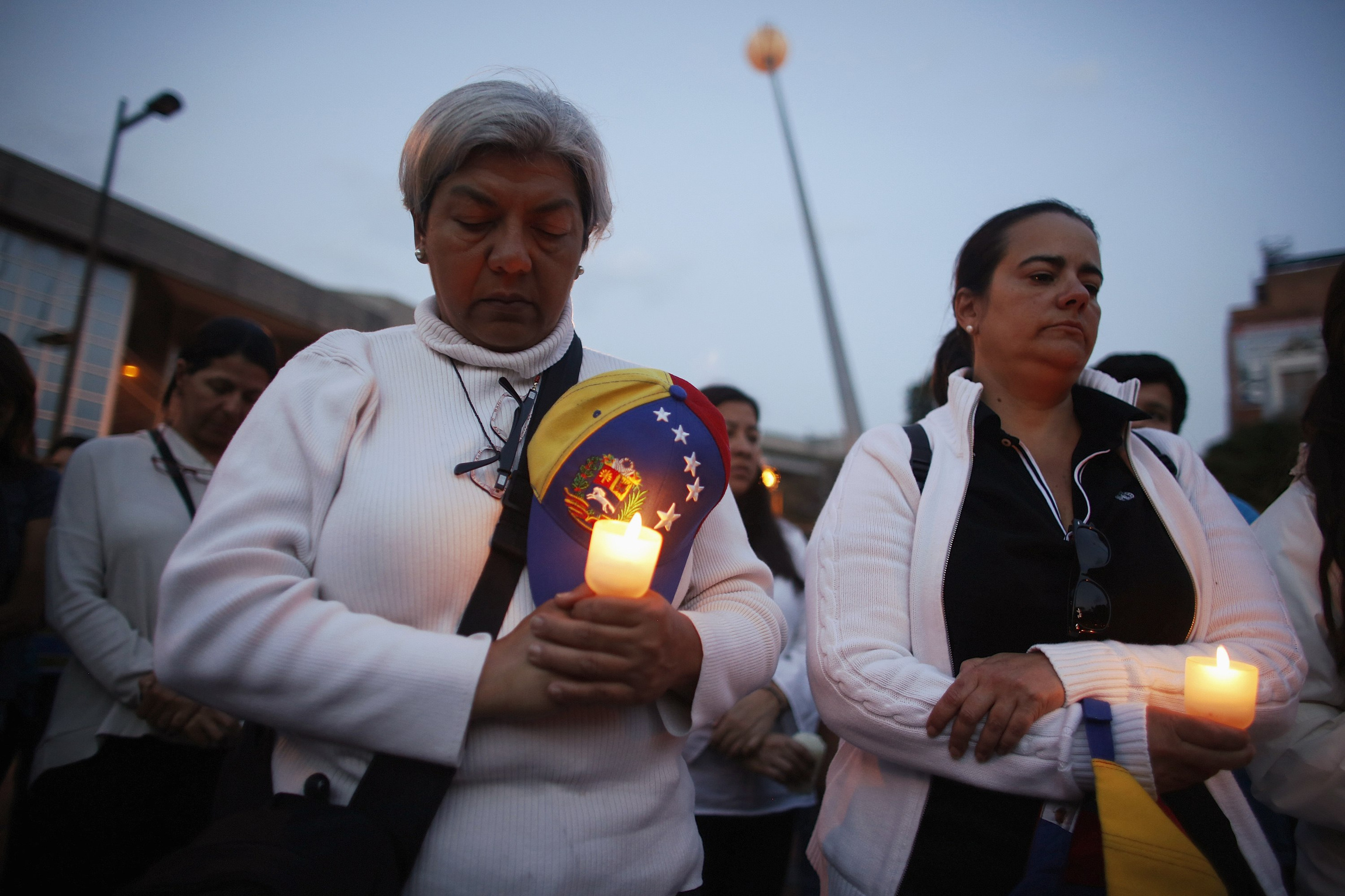 Anti-government protesters pray during a rally against violence in Caracas, Venezuela, in this March 5, 2014 file photo. Bishops in Caracas had urged both the government and protestors to resist violence amid a deepening standoff in Venezuela that has further polarized the country and left Church charities struggling. (CNS photo/Tomas Bravo, Reuters)
