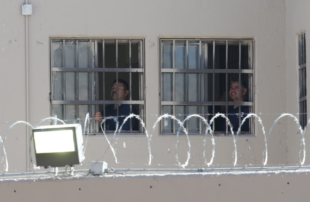 Inmates watch as Pope Francis visits Cereso prison in Ciudad Juarez, Mexico, Feb. 17. (CNS photo/Paul Haring) 