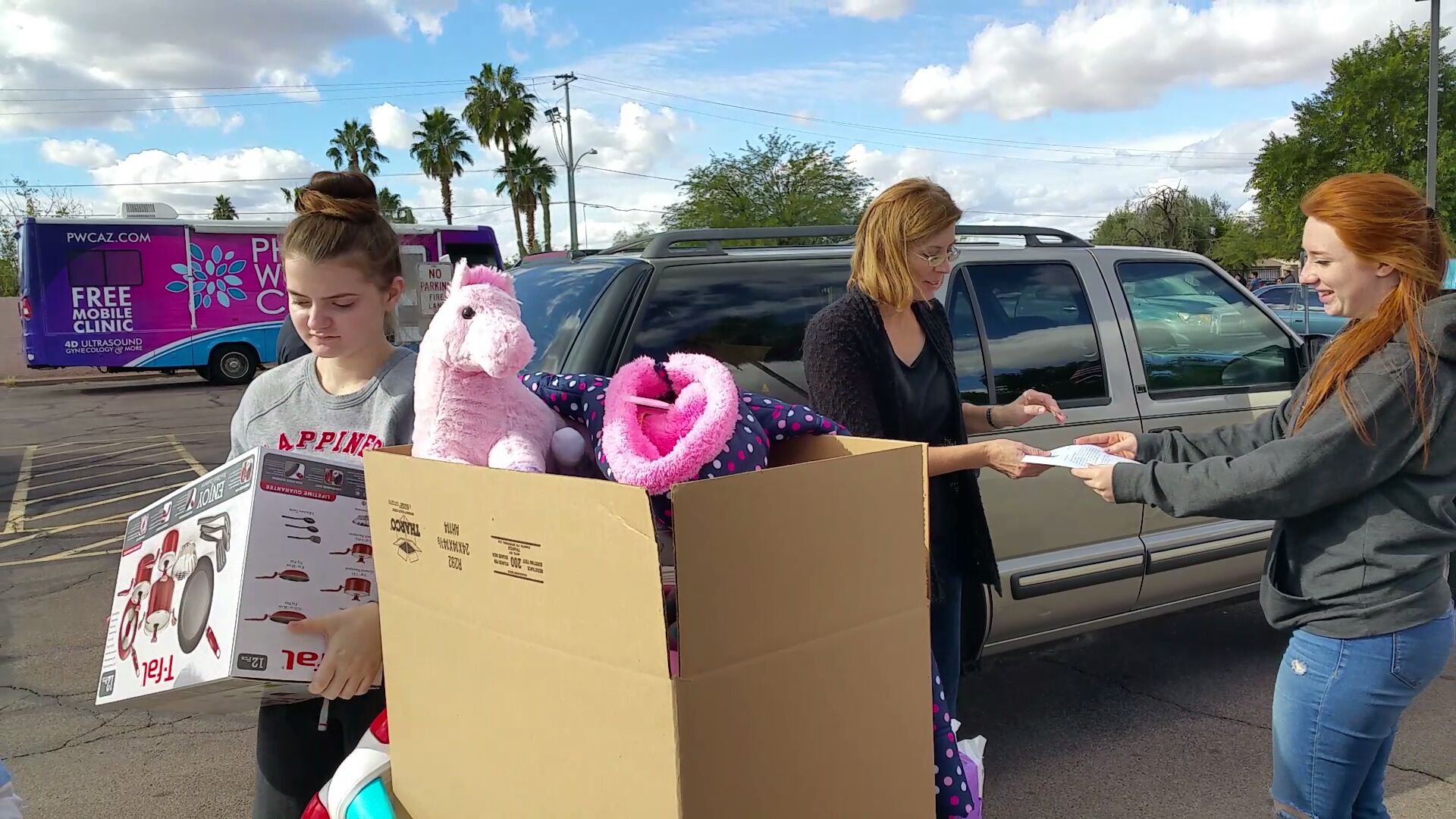 Volunteers from St. Joan of Arc parish load toys into boxes as gifts to children in the Navajo Nation. (Photo courtesy of St. Joan of Arc Parish)