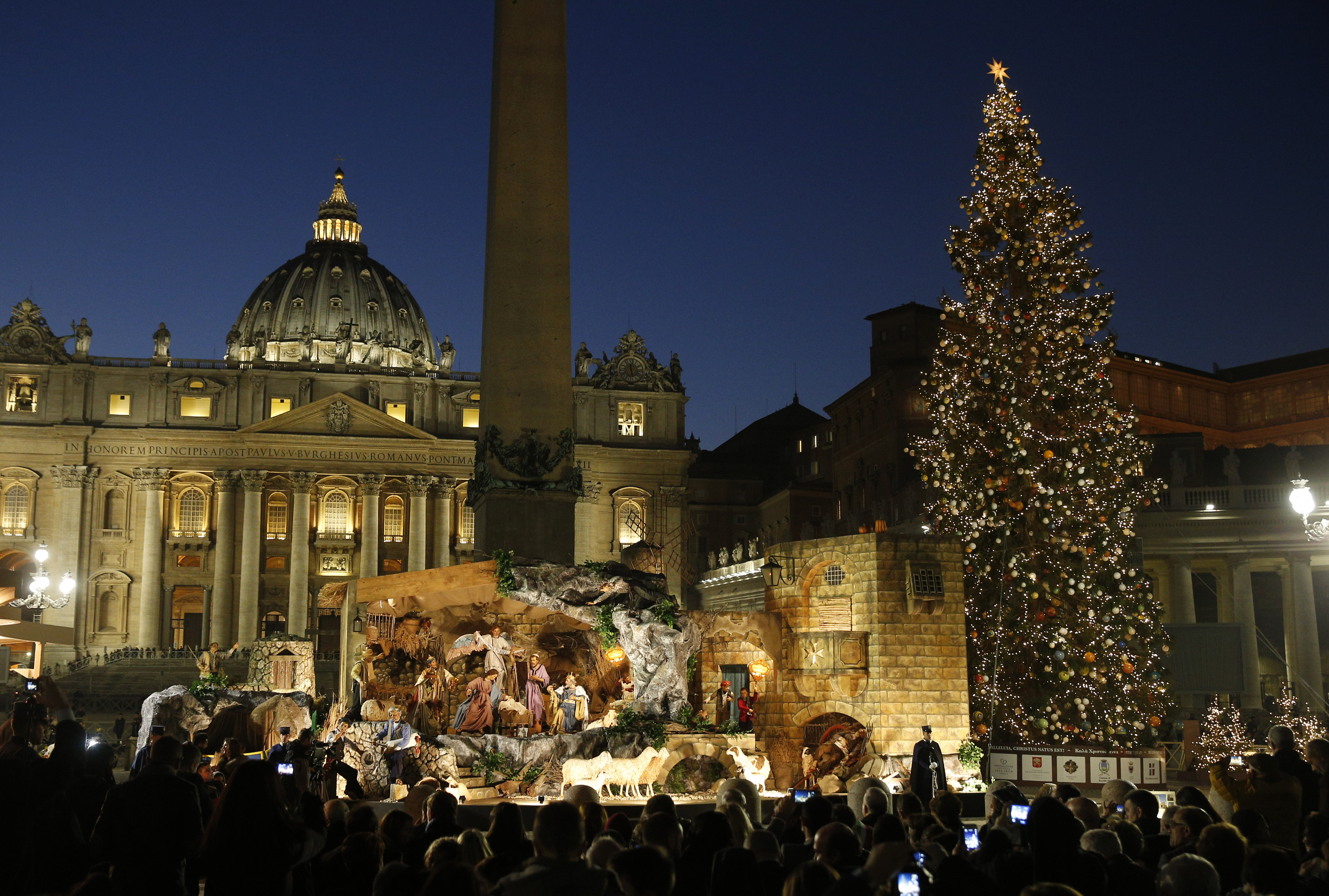 The Christmas tree and Nativity scene are pictured in St. Peter's Square after a lighting ceremony at the Vatican Dec. 9. (CNS photo/Paul Haring)